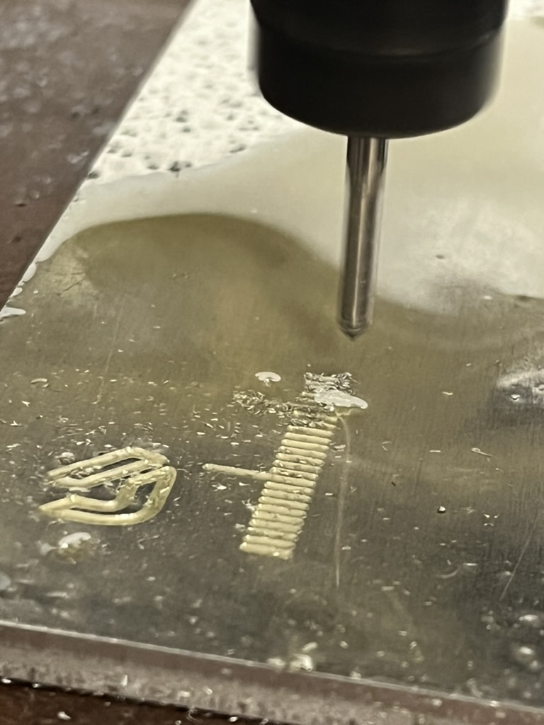 Machining a pocket ruler from aluminum plate.
